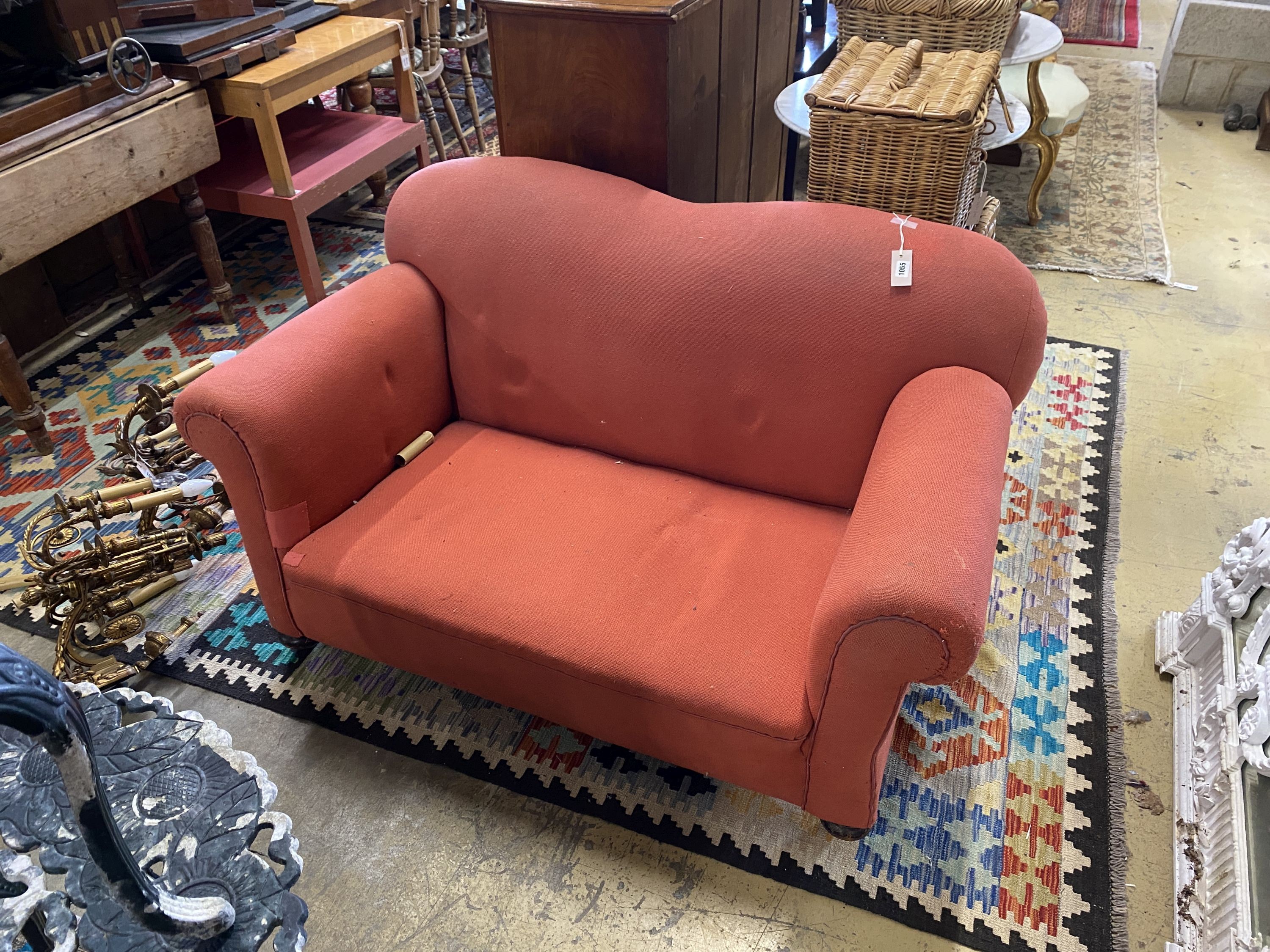 An early 20th century drop arm two seater chesterfield settee, length 136cm, depth 78cm, height 76cm